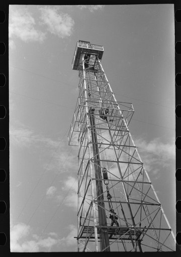 Untitled photo, possibly related to: Oil derrick, Oklahoma City, Oklahoma. Workers are pulling out pipe