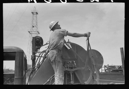 Winch operator at oil well in Oklahoma City, Oklahoma