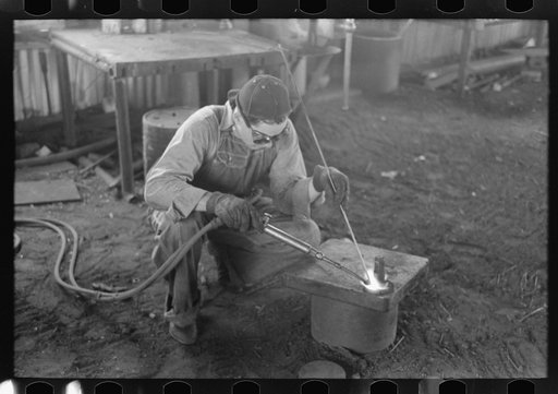 Untitled photo, possibly related to: Acetylene welding, a necessary part of oil field activities, Seminole, Oklahoma