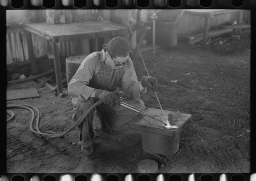 Acetylene welding, a necessary part of oil field activities, Seminole, Oklahoma