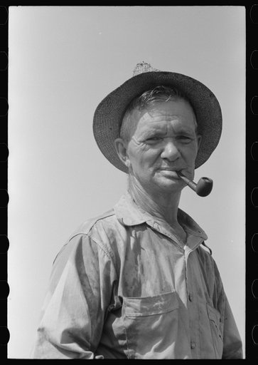 Untitled photo, possibly related to: Veteran oil worker now in a ditch-digging gang. He has done everything in oil fields, from drilling to pipeline work. Seminole oil field, Oklahoma