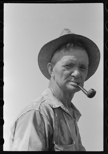 Veteran oil worker now in a ditch-digging gang. He has done everything in oil fields, from drilling to pipeline work. Seminole oil field, Oklahoma