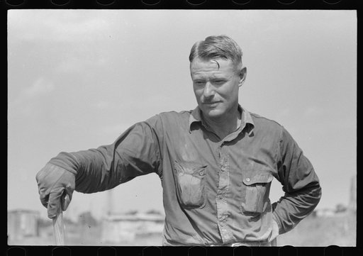 Roustabout in the ditch-digging crew. Notice the sweated shirt. Seminole oil field, Oklahoma