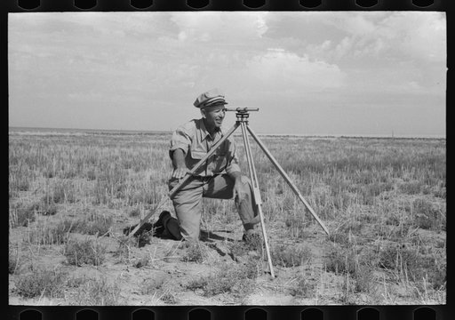 Untitled photo, possibly related to: FSA (Farm Security Administration) client running a line with transit. This is a new way of working off grants; better than the direct gift to the client. Gray County, Kansas