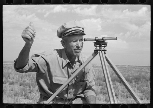 Untitled photo, possibly related to: FSA (Farm Security Administration) client running a line with transit. This is a new way of working off grants; better than the direct gift to the client. Gray County, Kansas