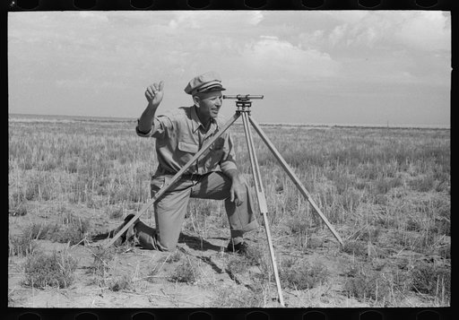 FSA (Farm Security Administration) client running a line with transit. This is a new way of working off grants; better than the direct gift to the client. Gray County, Kansas