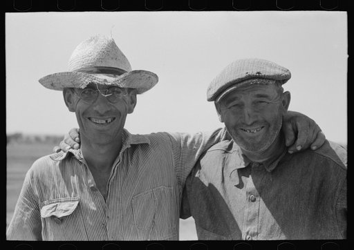 Cooperation in irrigation well. Mr. Johnson and Mr. Wright, FSA (Farm Security Administration) clients, Syracuse, Kansas