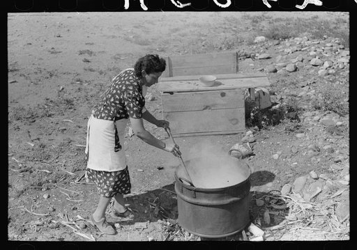 Spanish-American FSA (Farm Security Administration) client stirring kettle of soap, Taos County, New Mexico