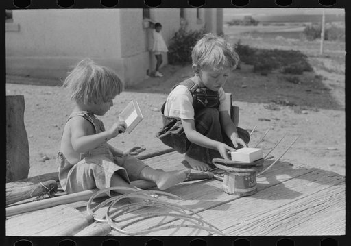 Untitled photo, possibly related to: Children of Spanish-American farm family playing on wagon, Taos County, New Mexico