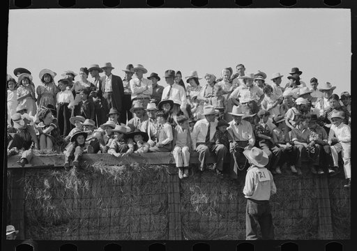 Spectators at Bean Day rodeo, Wagon Mound, New Mexico
