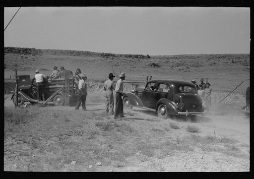 Paying admission fee at Bean Day rodeo, Wagon Mound, New Mexico