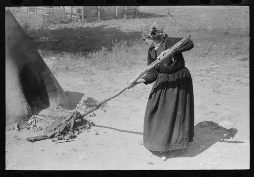 Pulling out hot coals with wet cloth, Taos County, New Mexico