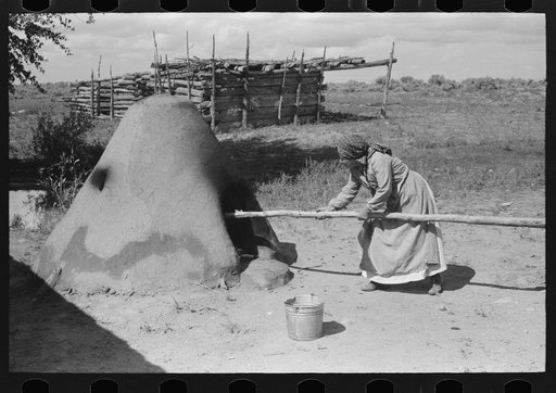 Untitled photo, possibly related to: Pulling out hot coals with wet cloth, Taos County, New Mexico