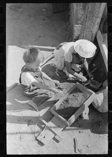 Spanish-American farm children playing, Taos County, New Mexico
