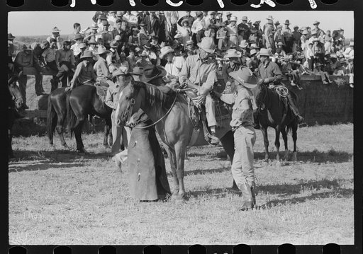 Cowboys talking, Bean Day rodeo, Wagon Mound, New Mexico