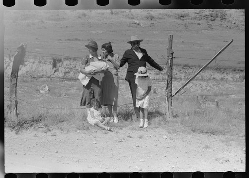 Wagon Mound, New Mexico. Spanish-American family waiting at the gate at Bean Day Rodeo