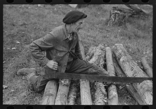 Farmer sawing wood near Bradford, Vermont