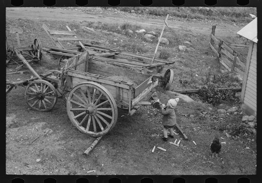 Untitled photo, possibly related to: Wagon and agricultural equipmenmt on farm near Bradford, Vermont