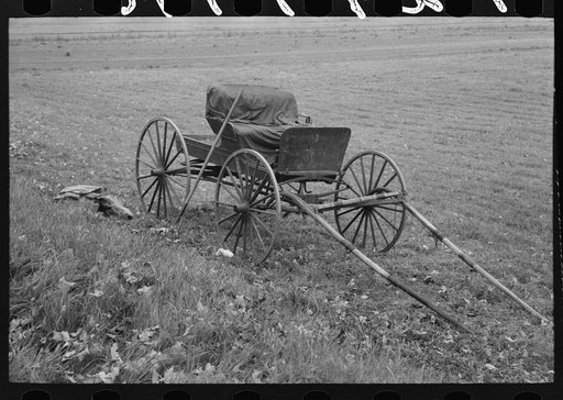 Untitled photo, possibly related to: Old buggy and pitchfork on farm near Northampton, Massachusetts
