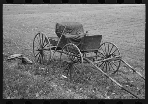 Old buggy and pitchfork on farm near Northampton, Massachusetts