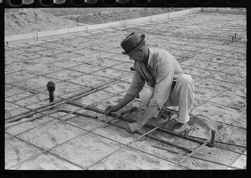 Untitled photo, possibly related to: Fitting water pipe at migrant camp under construction at Sinton, Texas