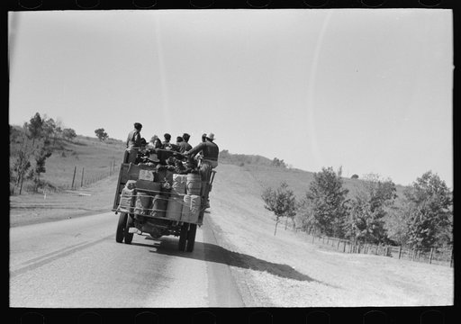 Truckload of Mexican migrants returning from Mississippi where they had been picking cotton. Highway near Neches, Texas, Anderson County