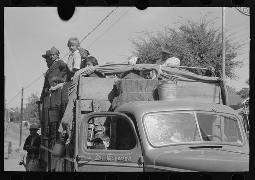 Truckload of Mexican migrants returning to their homes in the Rio Grande Valley from Mississippi where they had been picking cotton. Neches, Texas
