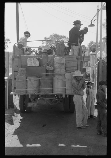 Truckload of Mexican migrants returning to their homes in the Rio Grande Valley from Mississippi where they had been picking cotton. Neches, Texas