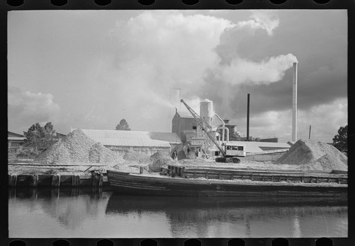 Untitled photo, possibly related to: Along the banks of the Port of Houston are several crushing plants for oyster shell. Oyster shell products are used for cement, roads and fertilizer. Houston, Texas