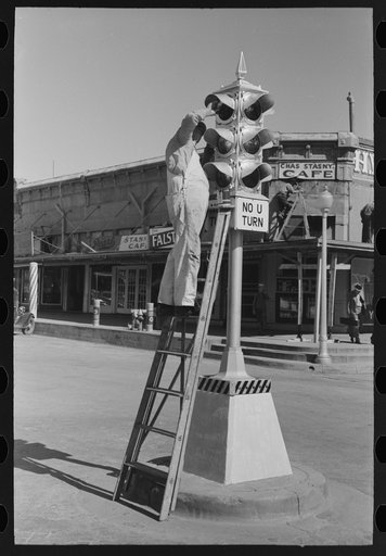 Painting traffic lights, Taylor, Texas