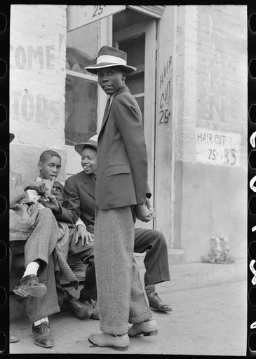 Untitled photo, possibly related to: Negro boys sitting on bench on street, Waco, Texas