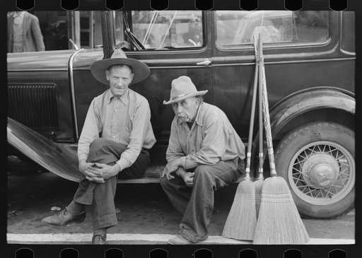 Men sitting on side of car, market square, Waco, Texas