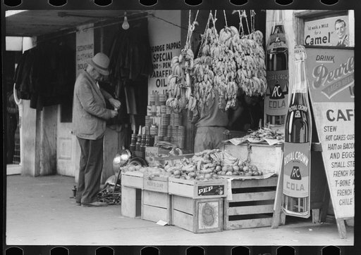 Untitled photo, possibly related to: Mexican worker paying for merchandise, market square, Waco, Texas