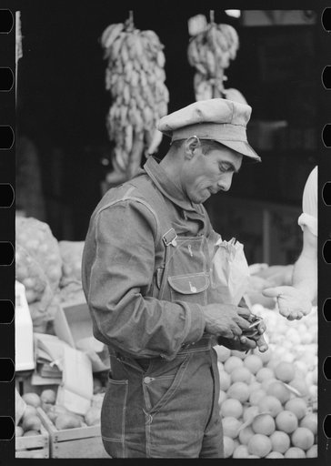 Mexican worker paying for merchandise, market square, Waco, Texas
