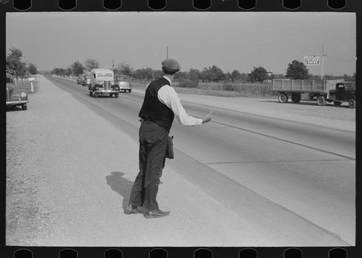Hitchhiker at city limits of Waco, Texas