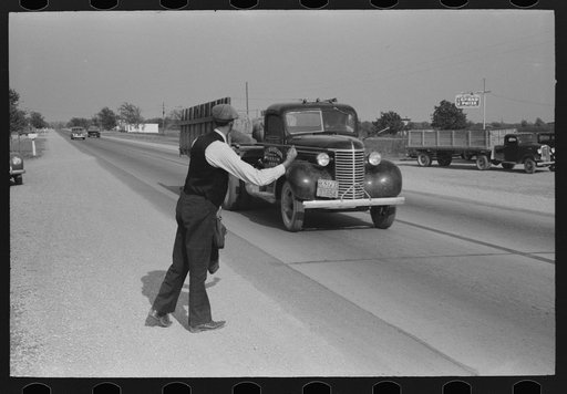 Hitchhiker at city limits of Waco, Texas
