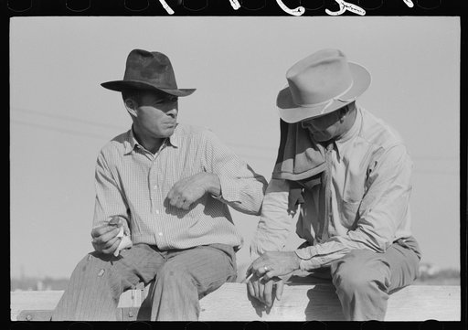 Untitled photo, possibly related to: Stockmen sitting on fence at stockyard, San Angelo, Texas
