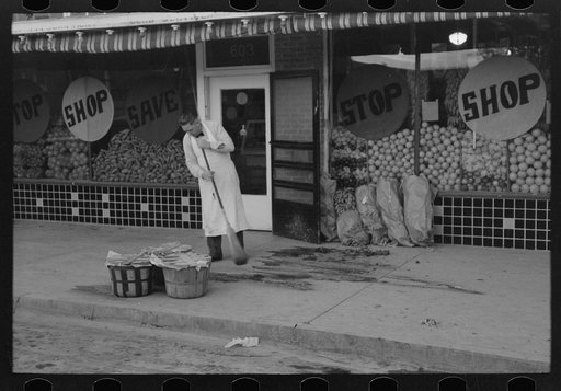 Sweeping off walk in the early morning, San Angelo, Texas