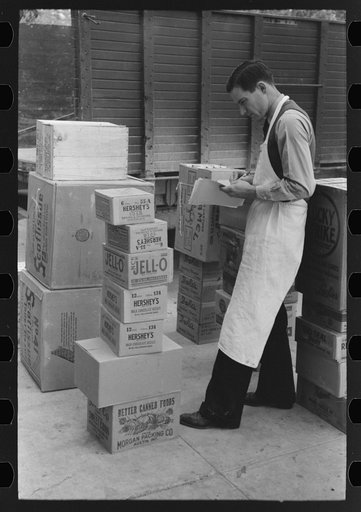 Checking delivery of supplies from wholesale grocery store, San Angelo, Texas