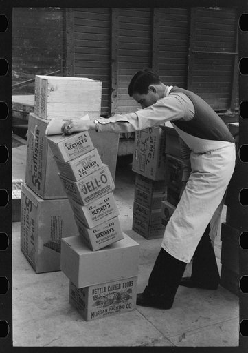 Checking delivery of supplies from wholesale grocery store, San Angelo, Texas