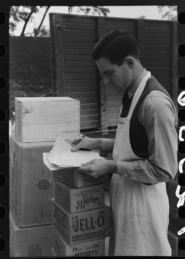 Checking delivery of supplies from wholesale grocery store, San Angelo, Texas