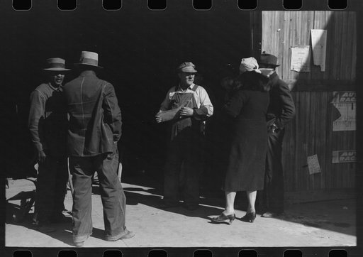 Untitled photo, possibly related to: Pomp Hall, Negro tenant farmer, talking to another farmer as he waits at the blacksmith shop in Depew, Oklahoma for his plow points to be sharpened. Pomp Hall is considered one of the best farmers in this county and is consulted by Negroes and whites concerning f