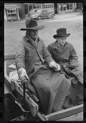 Farmer and son arriving in town in wagon, Eufaula, Oklahoma