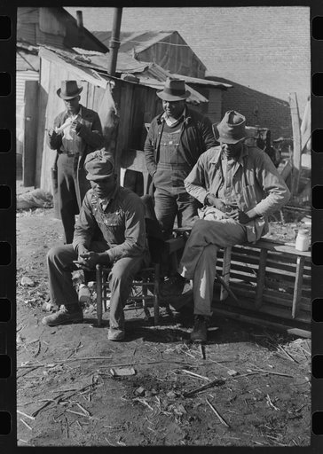 Untitled photo, possibly related to: Negro playing marbles on the first warm day in the spring. In this game the players shoot from hole to hole, the same idea as in golf or miniature golf. Eufaula, Oklahoma