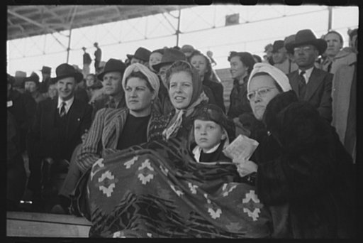 Untitled photo, possibly related to: Spectators at a tense moment during the rodeo at the San Angelo Fat Stock Show, San Angelo, Texas