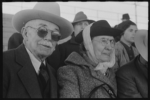 Untitled photo, possibly related to: Elderly couple at the rodeo during the San Angelo Fat Stock Show, San Angelo, Texas