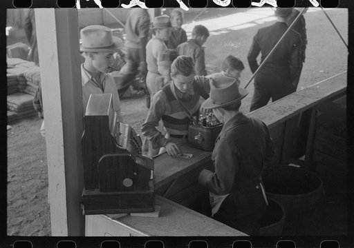 Sodapop peddler getting his supply from the main stand, rodeo at the San Angelo Fat Stock Show, San Angelo, Texas