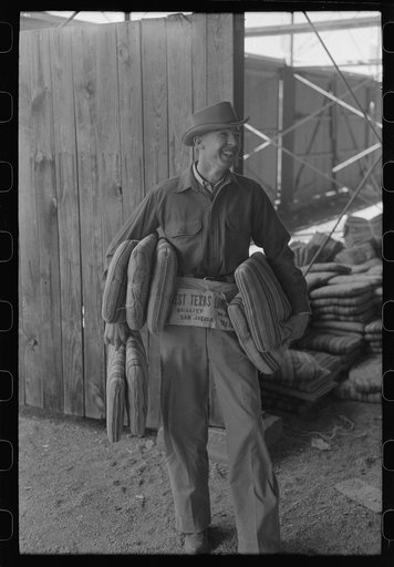 Cushion seller at the rodeo during the San Angelo Fat Stock Show, San Angelo, Texas