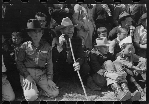 Untitled photo, possibly related to: Spectators at a side show where a man unloosens himself from chains and ropes, San Angelo Fat Stock Show, Texas