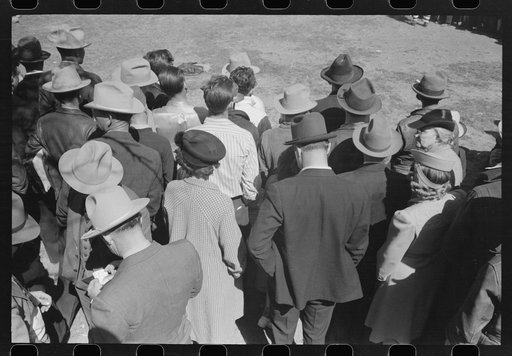 Backs of spectators at a sideshow, San Angelo Fat Stock Show, San Angelo, Texas